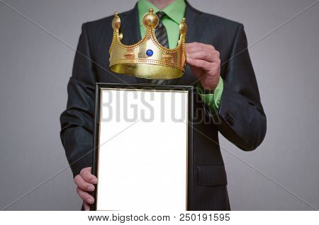 Winner Blank Diploma Or Certificate Mockup In Businessman Hand. Man Is Holding A Blank Photo Frame W