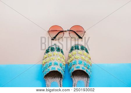 Summer Fashion Flatlay With Gradient Round Sunglasses And Espadrille Sandals On The Blue Background.