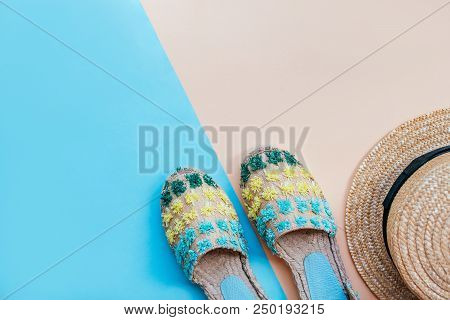 Summer Fashion Flatlay With Straw Hat And Espadrille Sandals On The Two-toned Blue And Beige Backgro