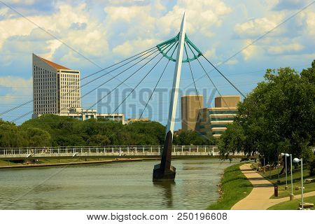 July 15, 2018 In Wichita, Ks:  Riverwalk Trail Besides The Arkansas River Including A Contemporary P