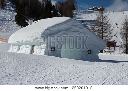 Frozen House Shaped Ttunnel, Snowpark In Dolomites Alps Mountains.