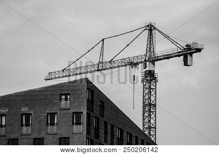 Construction Crane On The Corner Of The House