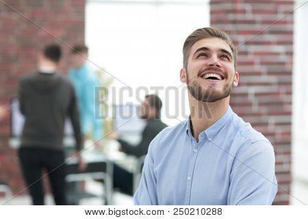 Cheerful man smiling  in office.