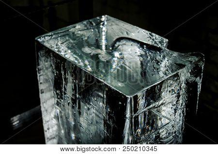 Top View Unlighted Big Clear Ice Cube Standing On The Floor On The Ice Production Plant