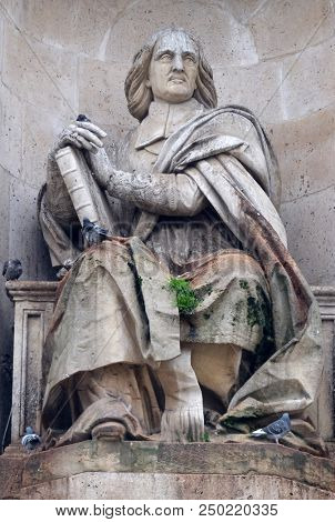 PARIS, FRANCE - JANUARY 04: Bossuet by Jean Jacques Feuchere, Fountain of the Sacred Orators, Place Saint-Sulpice in Paris, France on January 04, 2018.