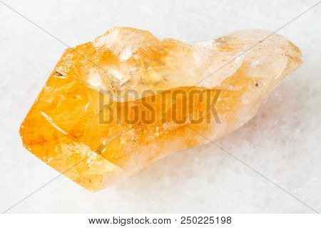 Macro Shooting Of Natural Rock Specimen - Crystal Of Citrine (yellow Quartz) Gemstone On White Marbl