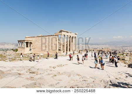 Athens, Greece - May 2018: Tourists Visiting The Ruins Of Old Temple Of Athena Polias Near Parthenon