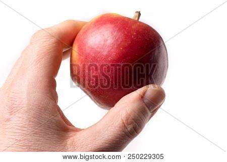 Causasian Hand Holding Apple Isolated On White Background