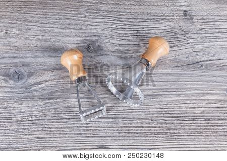 Cookie Cutter On An Antracyte Gray Wooden Board
