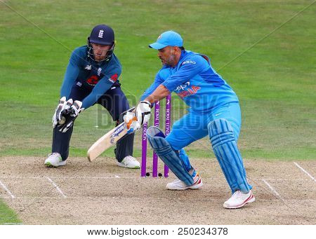 LEEDS, ENGLAND - JULY 17: Jos Buttler and MS Dhoni during the 3rd Royal London One day International match between England and India at Headingley Cricket Ground on July 17, 2018 in  England.  