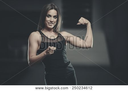 Beautiful Sexy Athletic Young Girl Working Out In Gym.