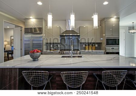 Sleek Modern Kitchen Design With A Gray Center Island
