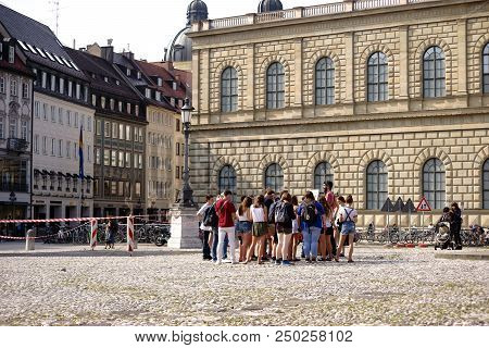 Munich, Germany - June 30: A Youth Group Stands On The Max-joseph-square Next To The Bronze Statue O