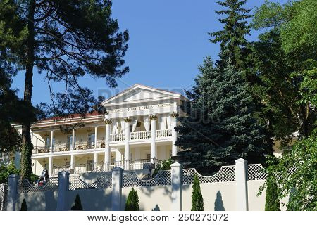 Snow-white Facade Of The Imperial Hotel On The Street Industrial House 38 In The Resort Village. Sun
