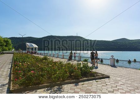 Roses On The Sunny Promenade Of The Picturesque Mountain Lake Abrau In The Resort Village
