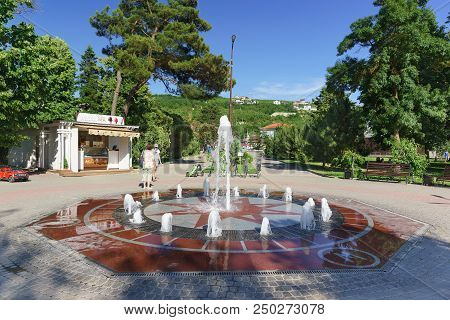 Fountain In The Park Of The Resort Village. A Hot Sunny Day