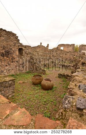 Ancient Ceramic Pots Found In The Ruins Of A Building In Pompeii Italy.