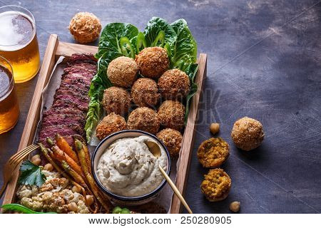 Close View Of Falafel, Babaghanoush And Pastrami In The Wooden Box, Copyspace