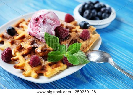 Belgian waffles with fresh berries and ice cream 