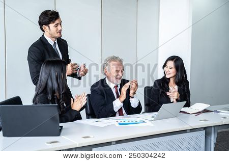 group of successful businessman. Discussion of the business profits of the company in meeting roon o