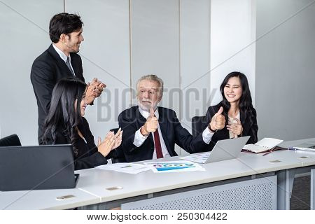 group of successful businessman. Discussion of the business profits of the company in meeting roon o