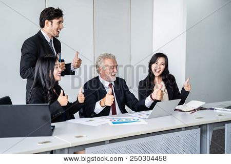 group of successful businessman. Discussion of the business profits of the company in meeting roon o