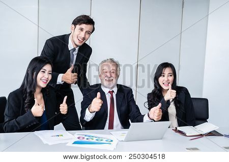 group of successful businessman. Discussion of the business profits of the company in meeting roon o