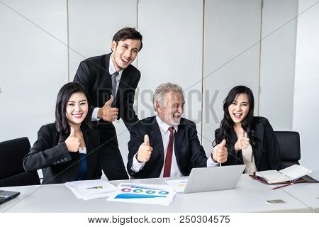 group of successful businessman. Discussion of the business profits of the company in meeting roon o