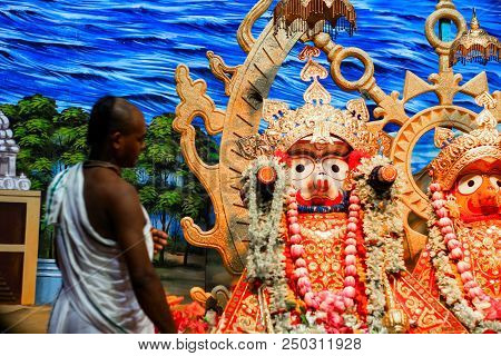 Durgapur, West Bengal, India. July, 2018 A Brahmin Purohit Panda Staring At Idol Of Jagannath Balara