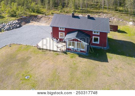 Ranea, Sweden - June 17, 2018: Aerial View Of A Small Red Wooden One Family House Orignated From The