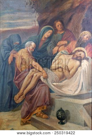 SISAK, CROATIA - DECEMBER 07: 14th Stations of the Cross, Jesus is laid in the tomb and covered in incense, Church of Visitation of the Virgin Mary in Sisak, Croatia, on December 07, 2017.