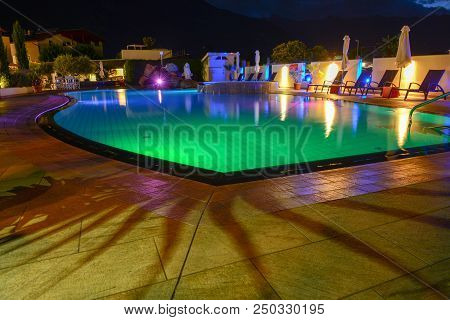 Swimming Pool At A Luxury Resort By Night In Lana