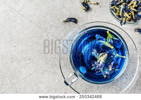 Healthy Drinks, Organic Blue Butterfly Pea Flower Tea With Limes And Lemons, Grey Concrete Backgroun