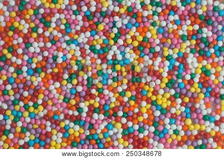 Colorful Bright Background Of Small Balls For Screen Saver For Designer. Multicolored Painted Grains