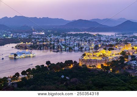 Udaipur City At Lake Pichola In The Evening, Rajasthan, India. View From  The Mountain Viewpoint See