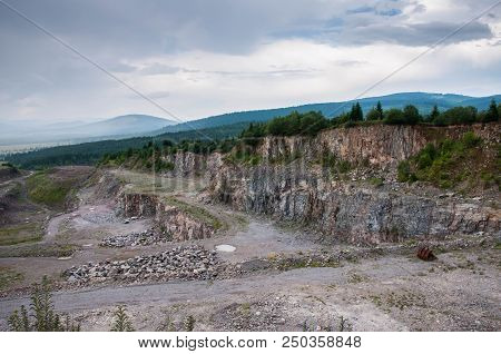 Abandoned Stone Pit, Quarry In Transylvania , Romania On Cloudy , Rainy Day.