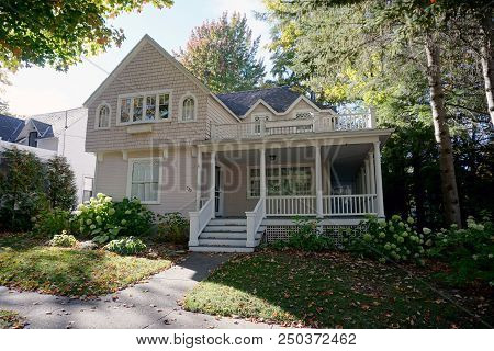 Bay View, Michigan / United States - October 17, 2017: A Pink Two Story Victorian Cottage, With A Ba