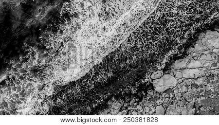 Aerial Photography. Waves Raged On The Sea Shore. Black And White Photo