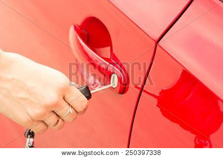 Close-up, The Girl Opens The Door Of A Red Car