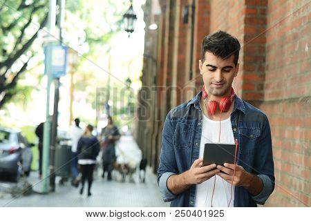 Man Using A Tablet.