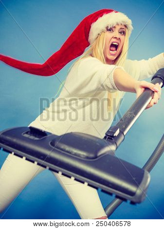 Woman Vacuuming The House, Last Minute. Teen Girl In Santa Helper Hat With Vacuum Cleaner, Angry Fur
