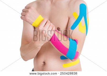 Kinesiology Taping On Human Hand, Isolated On White Background