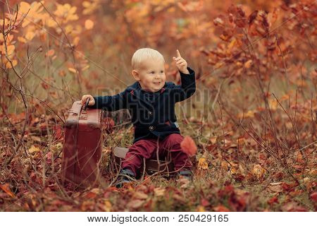 Adorable Boy On A Railway Station, Waiting For The Train With Suitcase