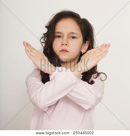 Little Girl Showing Stop Sign With Crossed Arms, Refuse Gesture