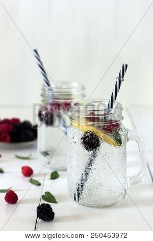 A Cooling Lemon Drink In A Glass Cup On A Wooden Table