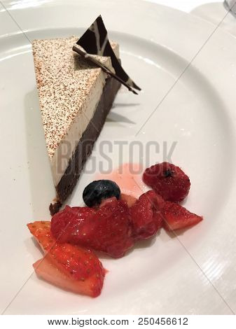 Chocolate Pie With Meringue And Berries On The Side