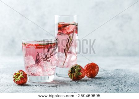 Alcoholic Or Non-alcoholic Cocktail With Strawberries And Rosemary And Ice In Glass Glasses. Free Sp
