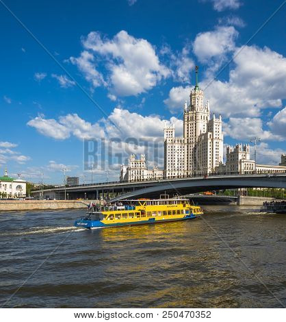Moscow, Russia - May 12. 2018. Moskva - Ships Sail On River Past Skyscraper On A Kotelnicheskaya Emb