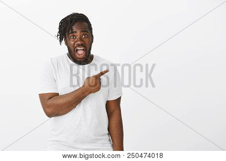 Omg, Look. Portrait Of Shocked Intense African-american Male Model With Beard, Pointing Right, Dropp