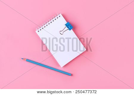 Top View Of Blank Notebook With Peb On Colorful Background Pink With Copy Space.